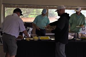 golfers in serving line